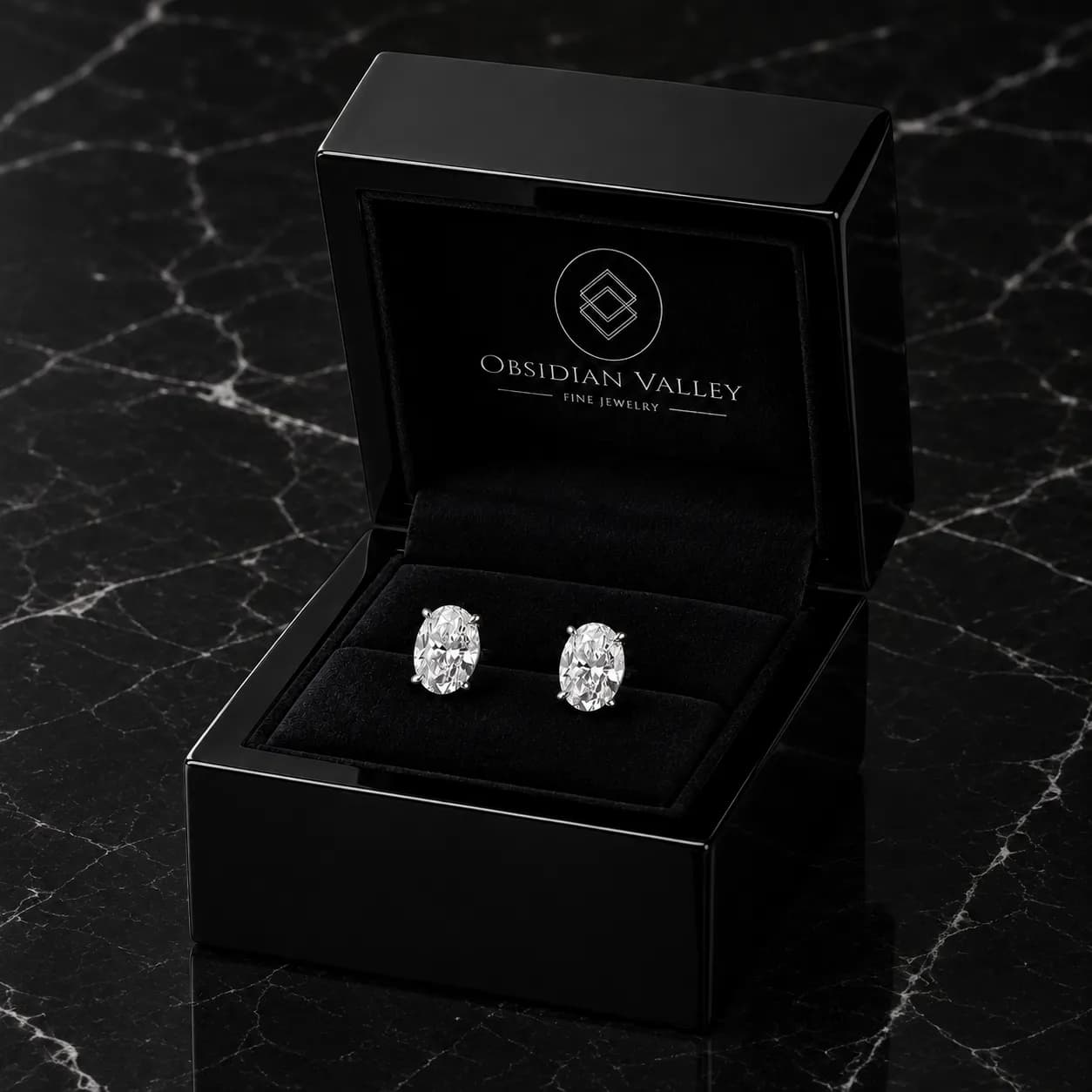 Signature Dauntless earrings in the Obsidian Valley black lacquer jewelry box on black marble